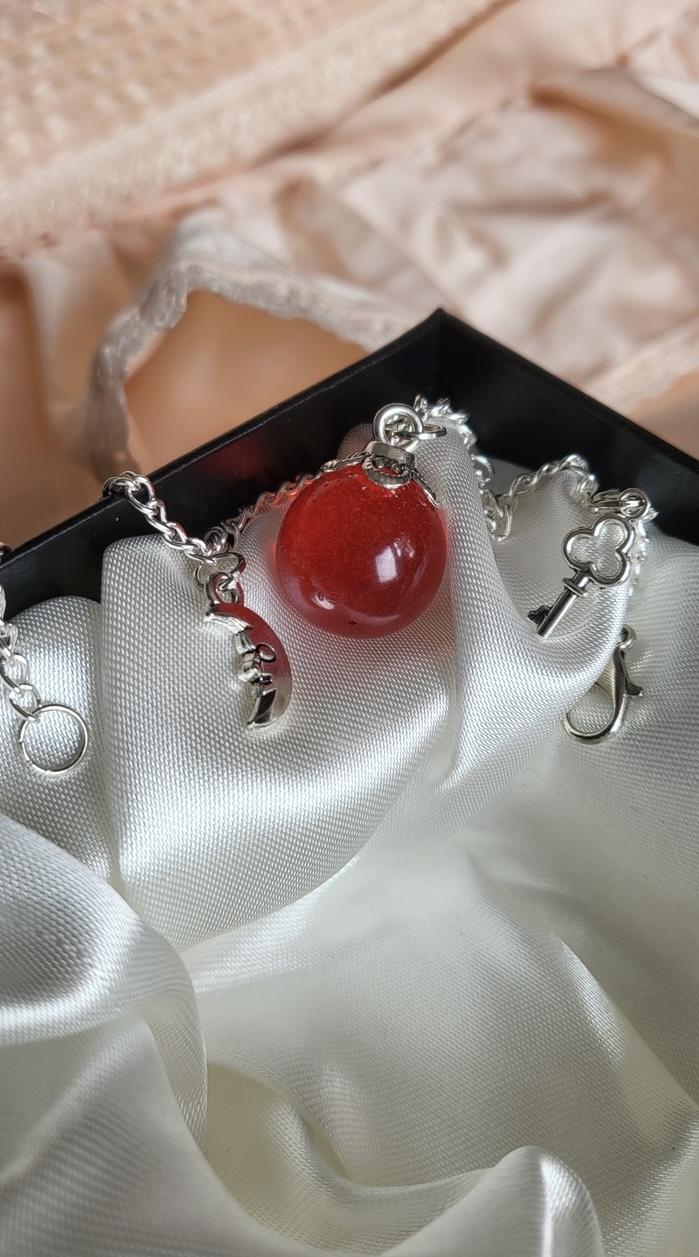 Ruby red, spooky themed resin ball bracelet