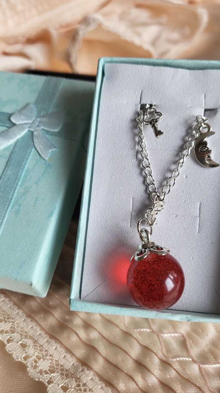 Ruby red, spooky themed resin ball bracelet