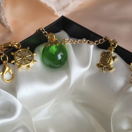 Emerald green ocean themed resin ball Bracelet