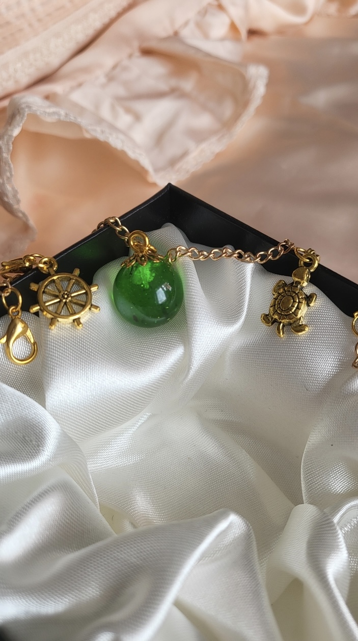Emerald green ocean themed resin ball Bracelet