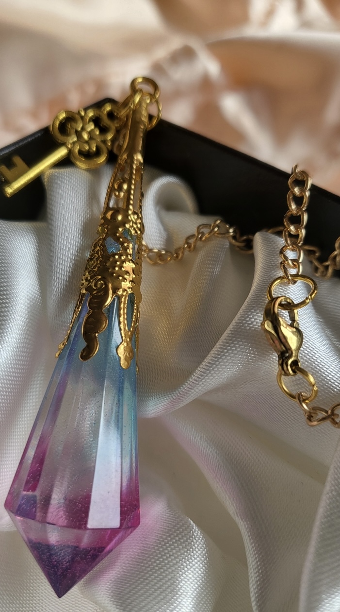 Beautiful pink and blue fantasy themed resin Crystal pendant necklace