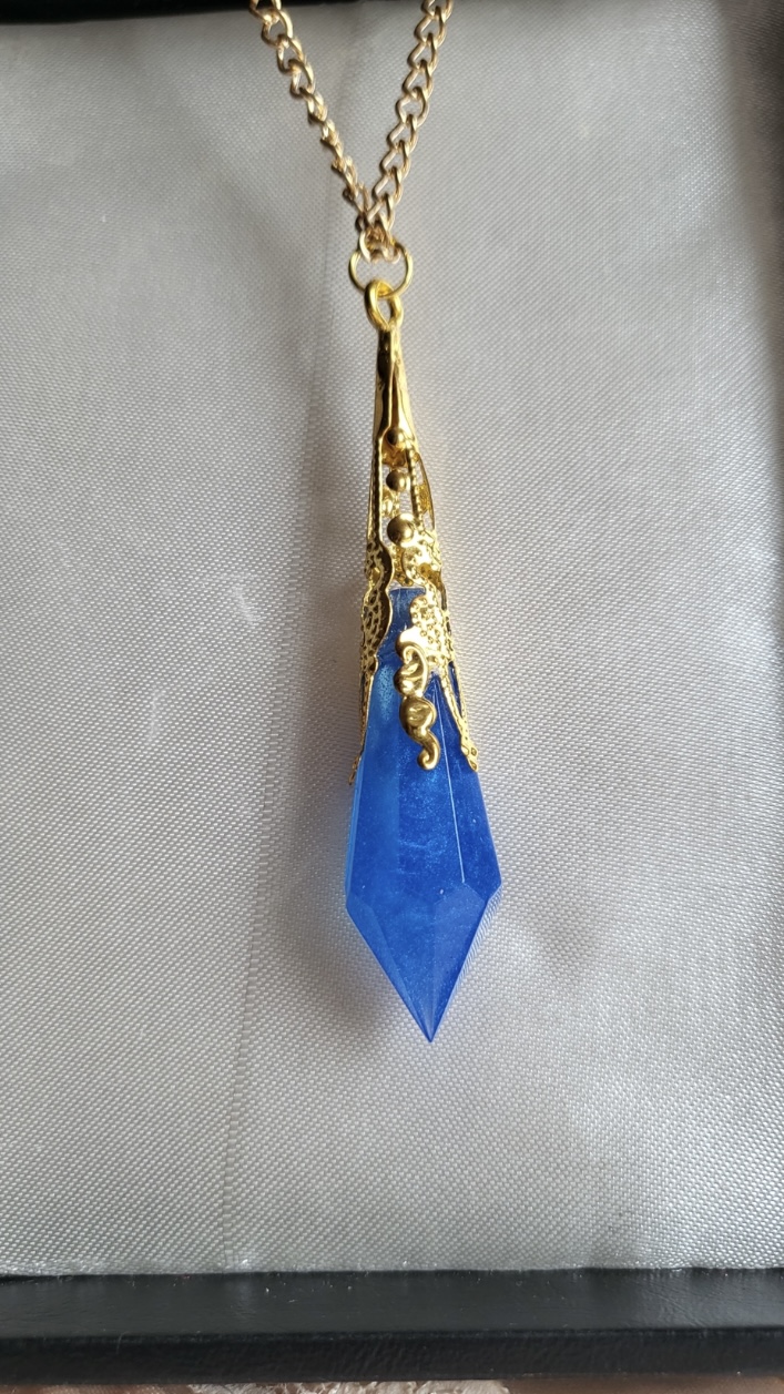 Royal blue fantasy themed pendant necklace
