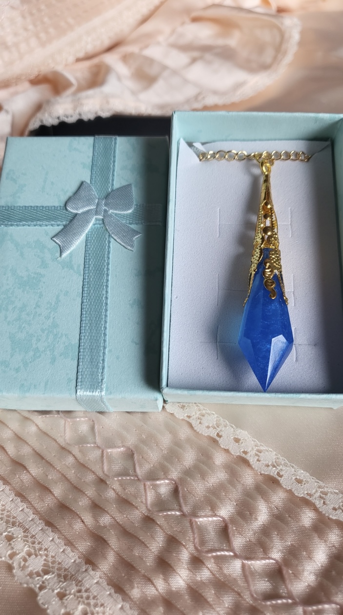 Royal blue fantasy themed pendant necklace