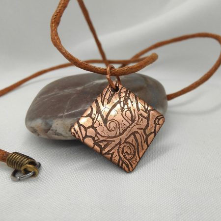 Handcrafted Copper Pendant with Floral Engraving