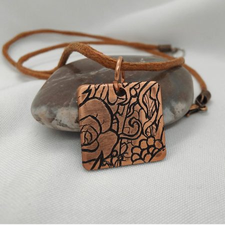 Handcrafted Copper Pendant with Floral Engraving