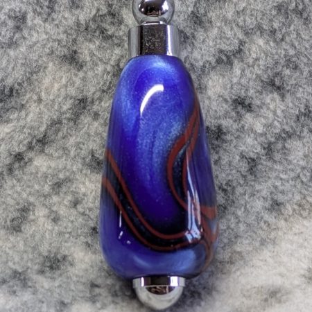 Light switch pull pendant made from blue acrylic with red swirls and chrome fittings
