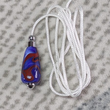 Light switch pull pendant made from blue acrylic with red swirls and chrome fittings