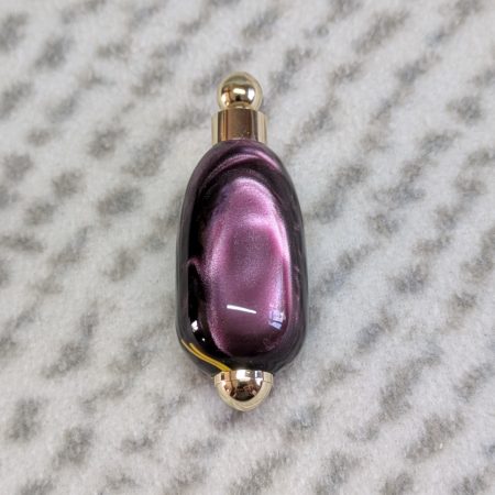 Light switch pull pendant made from Plum coloured acrylic with yellow lines