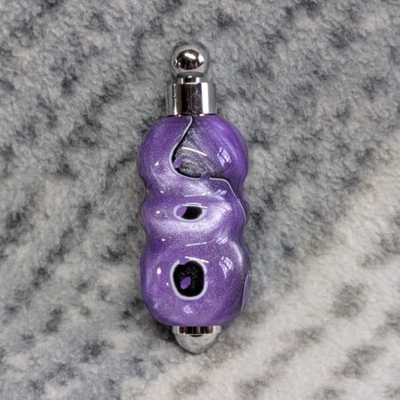 Light switch pull pendant made from shimmering purple acrylic and chrome fittings