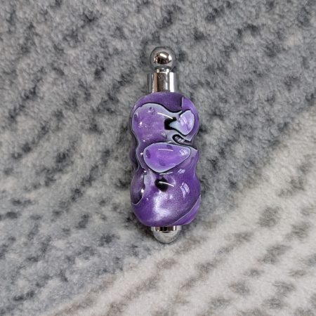 Light switch pull pendant made from shimmering purple acrylic