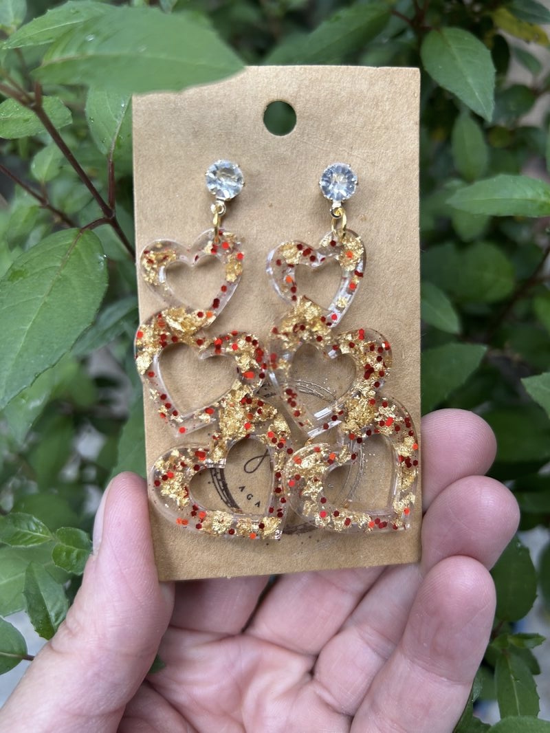 Three hearts stud earrings with gold