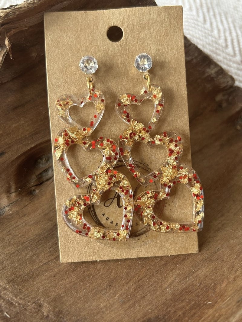 Three hearts stud earrings with gold