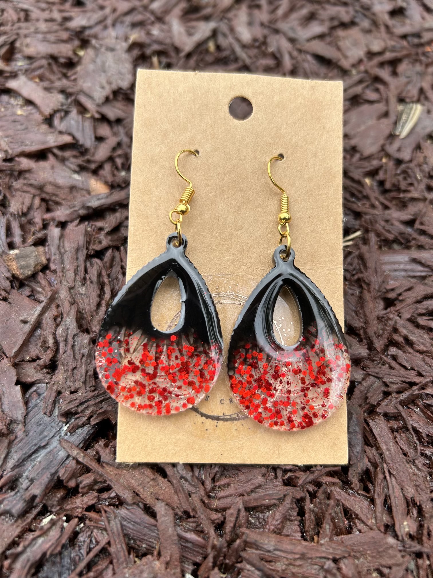 Large teardrop resin earrings with red sparkles