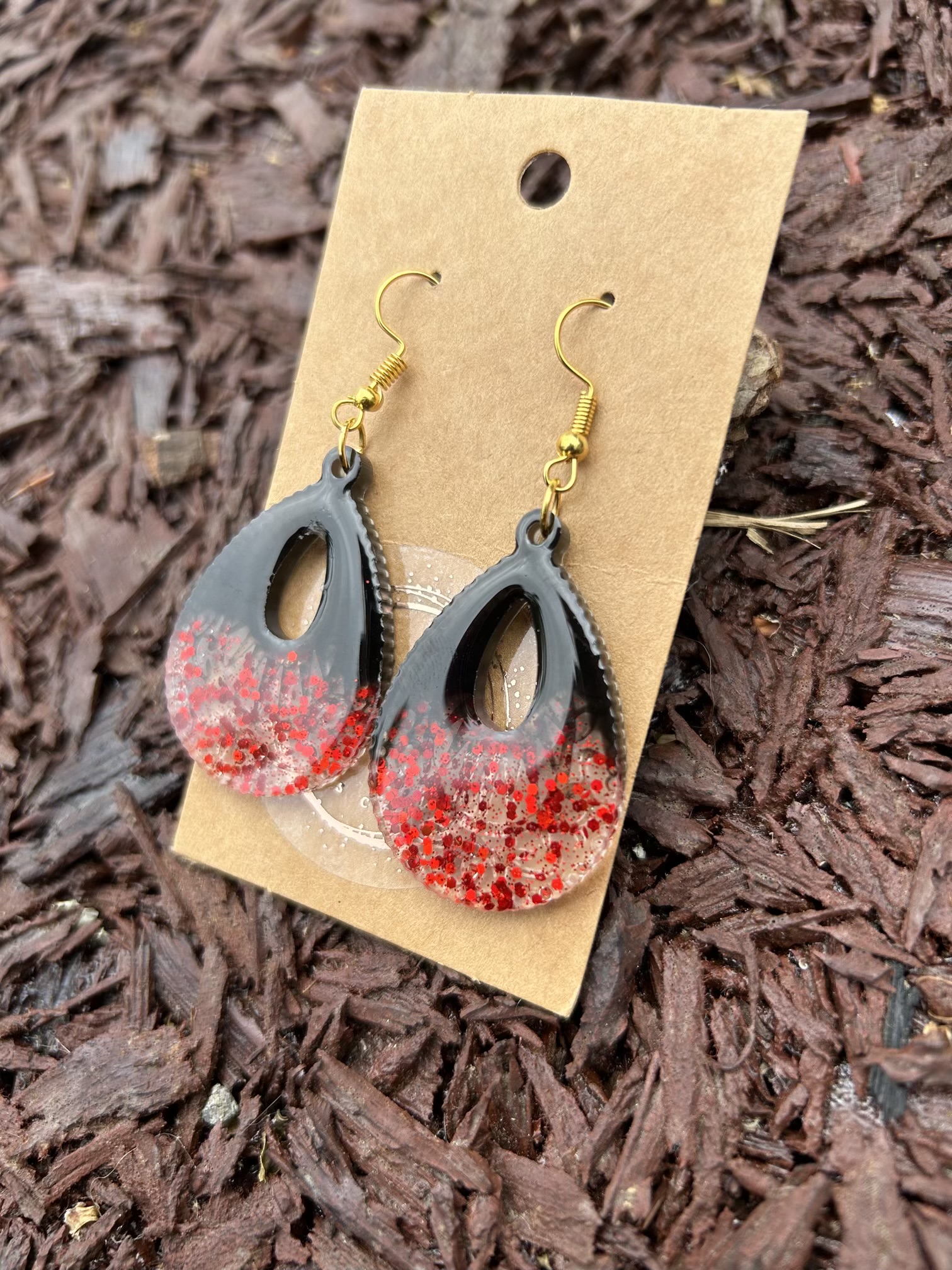 Large teardrop resin earrings with red sparkles