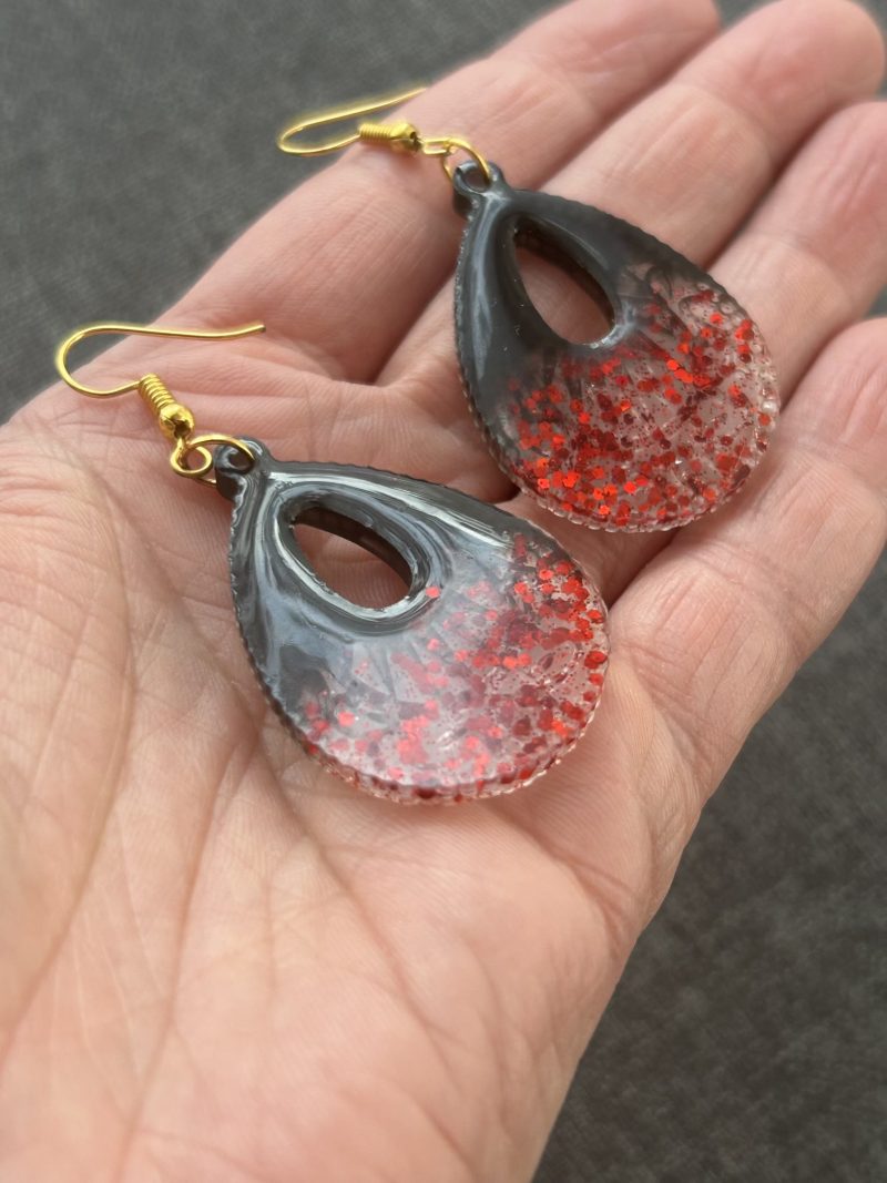 Large teardrop resin earrings with red sparkles