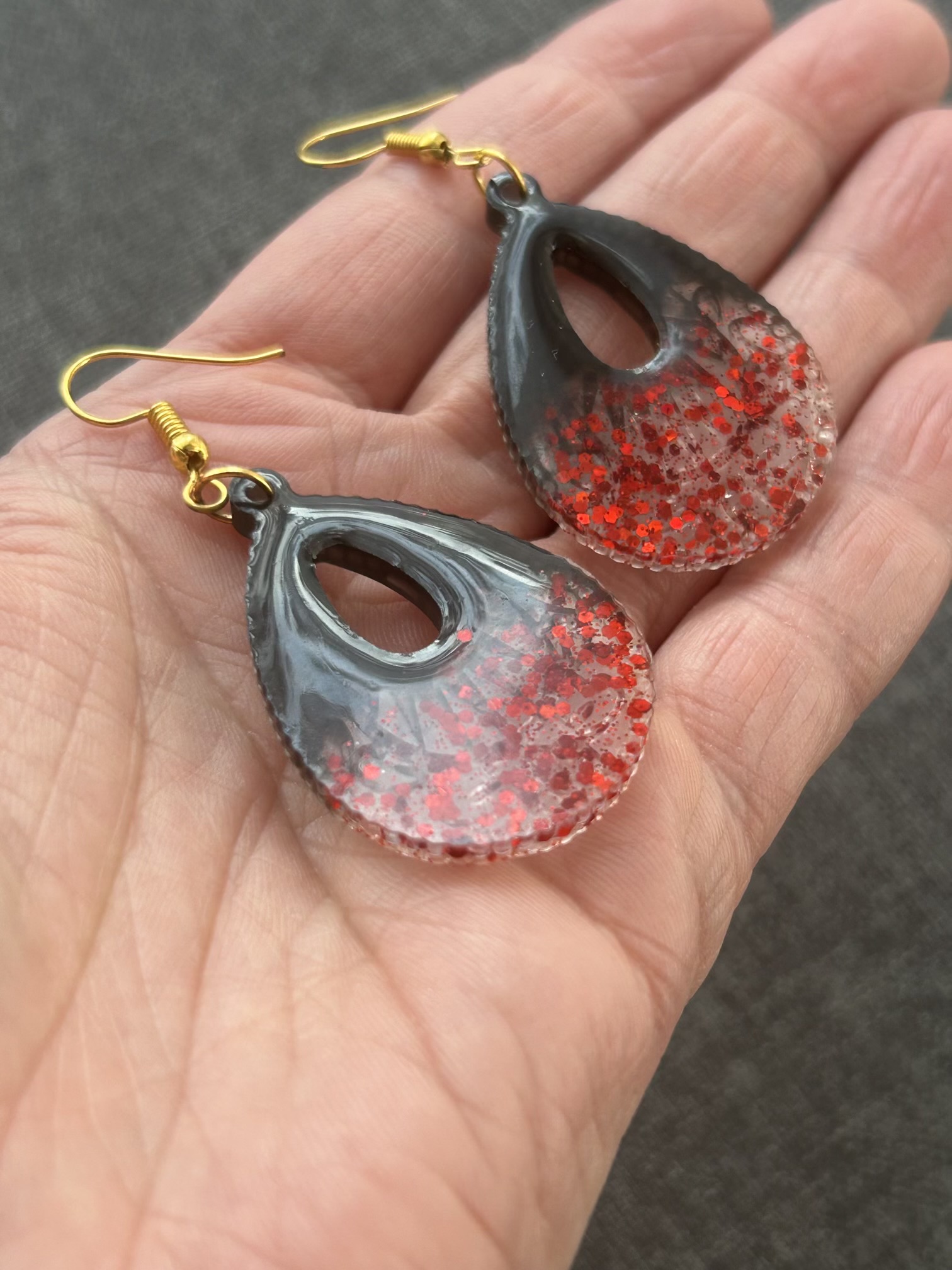 Large teardrop resin earrings with red sparkles