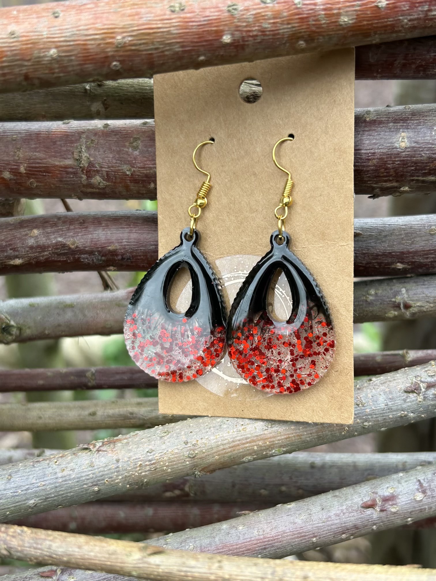 Large teardrop resin earrings with red sparkles