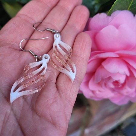 Resin earrings with white pigment and red glitter