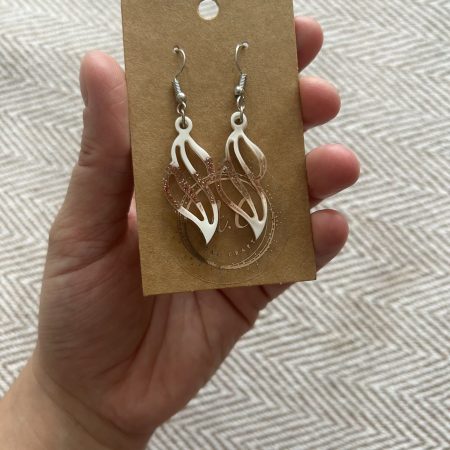 Resin earrings with white pigment and red glitter