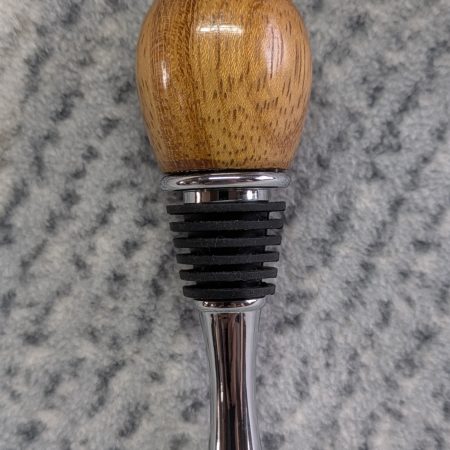 Hand turned bottle stopper made from iroko wood with a teardrop chrome base