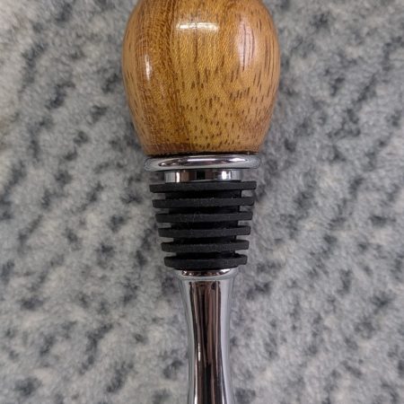 Hand turned bottle stopper made from iroko with a teardrop base