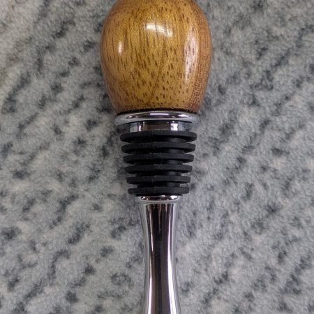 Hand turned bottle stopper made from iroko with a teardrop base
