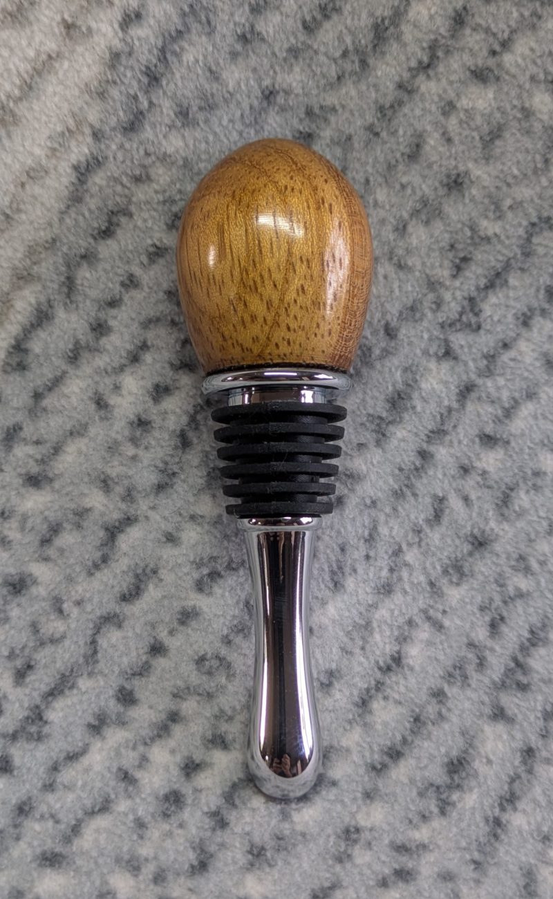Hand turned bottle stopper made from iroko with a teardrop base