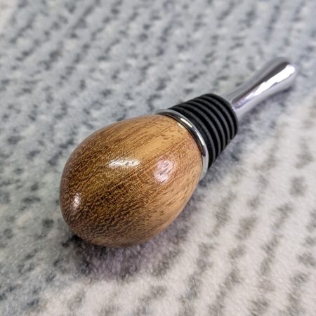 Hand turned bottle stopper made from iroko with a teardrop base