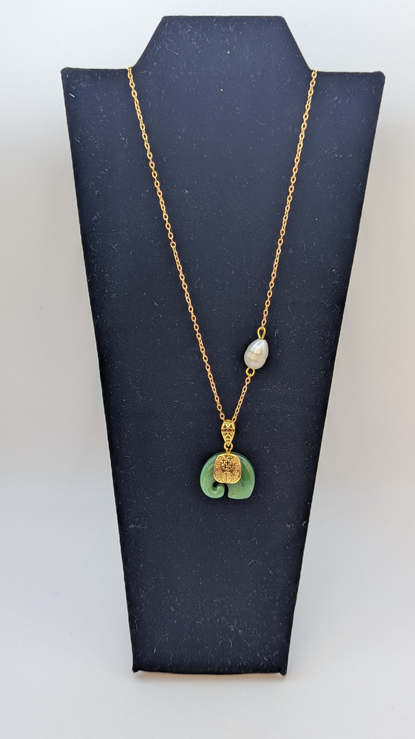 Jade elephant and freshwater pearl on a gold plated chain
