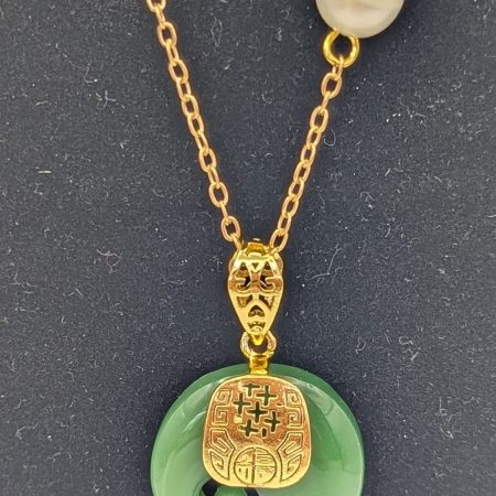 Jade elephant and freshwater pearl on a gold plated chain