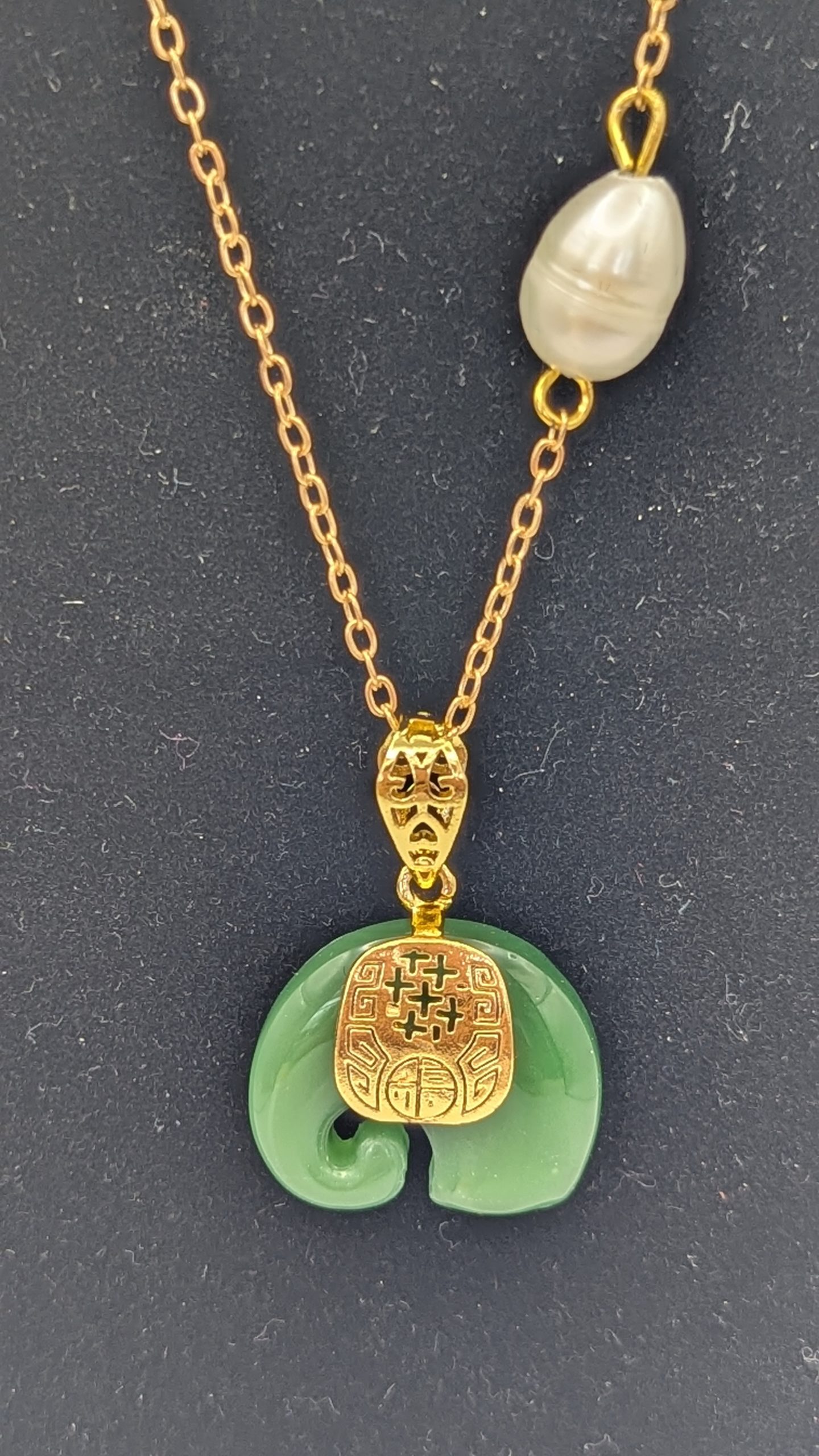 Jade elephant and freshwater pearl on a gold plated chain