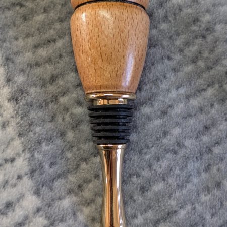 Hand turned bottle stopper made from beech with a 24 carat gold plated teardrop base