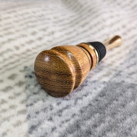 Hand turned bottle stopper made from iroko with a teardrop base