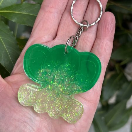 Resin lucky elephant keychain with green pigment and sparkly green glitter