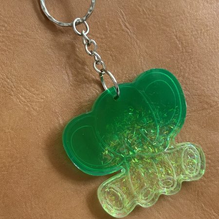 Resin lucky elephant keychain with green pigment and sparkly green glitter
