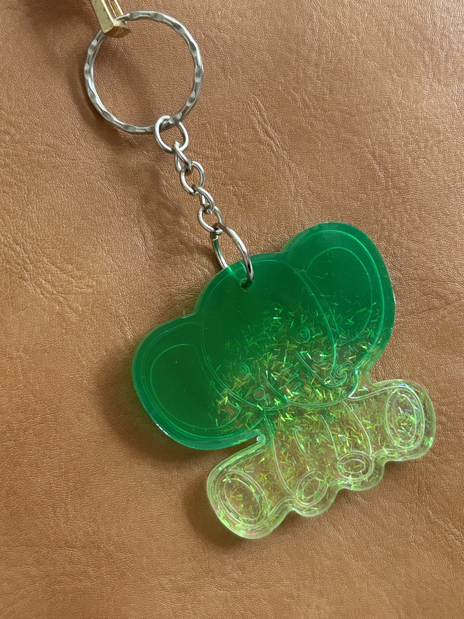 Resin lucky elephant keychain with green pigment and sparkly green glitter