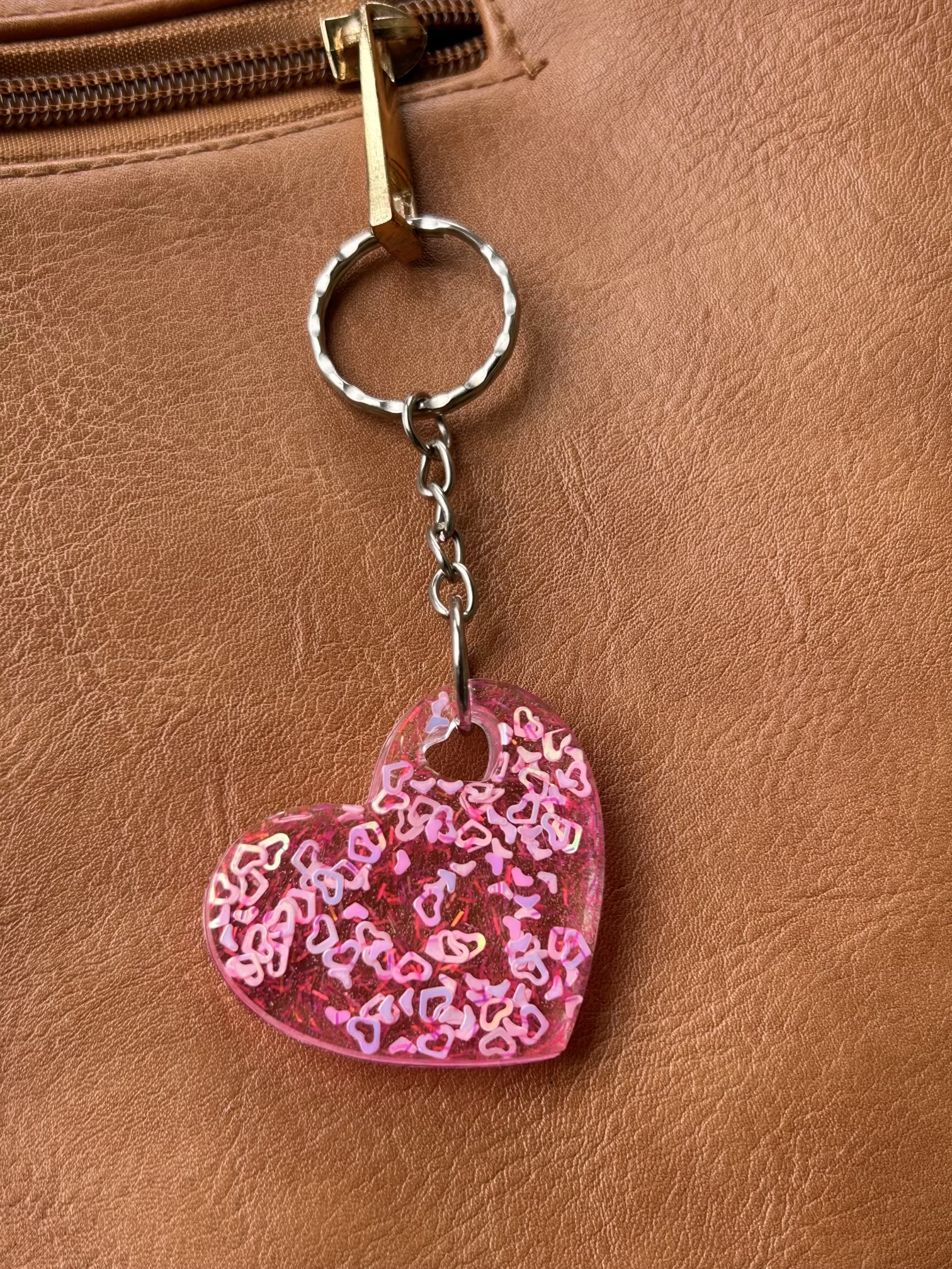 Resin heart shape keyring with small pink hearts and sparkly glitter