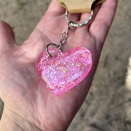 Resin heart shape keyring with small pink hearts and sparkly glitter