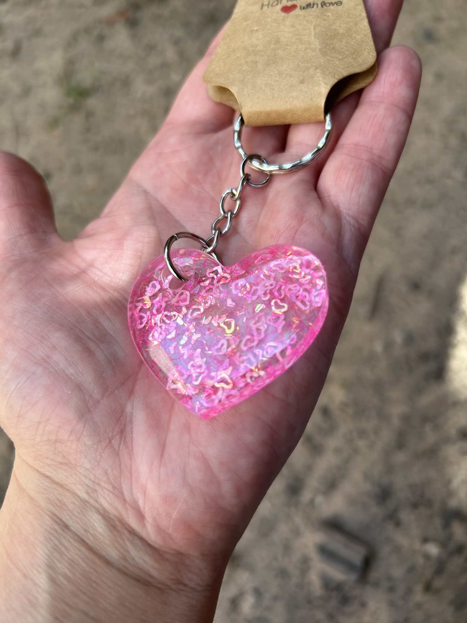 Resin heart shape keyring with small pink hearts and sparkly glitter