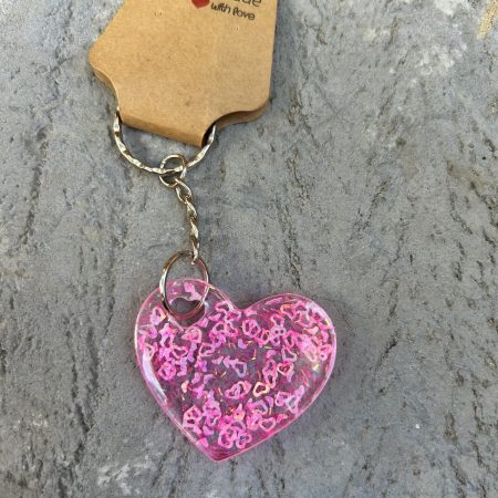 Resin heart shape keyring with small pink hearts and sparkly glitter