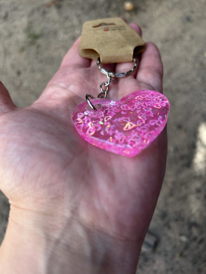 Resin heart shape keyring with small pink hearts and sparkly glitter