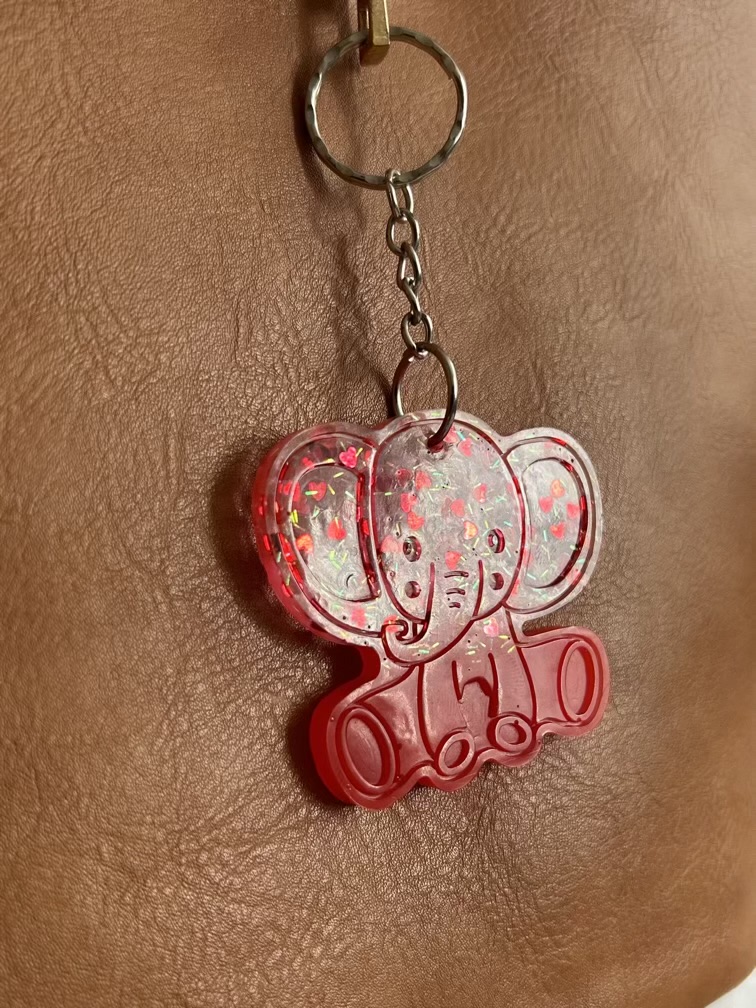 Resin elephant keychain with small heart sequins and fine sparkly glitter