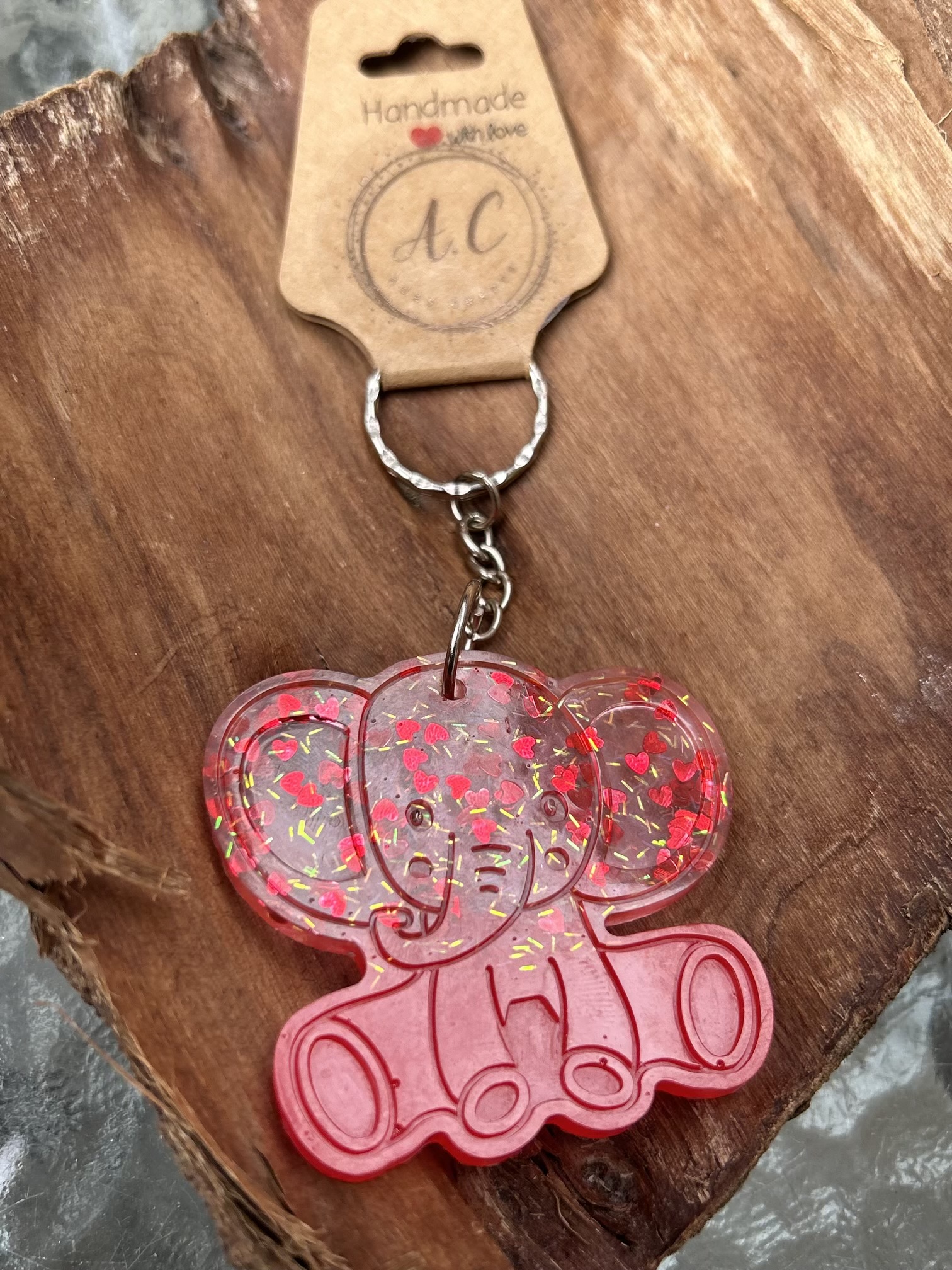 Resin elephant keychain with small heart sequins and fine sparkly glitter