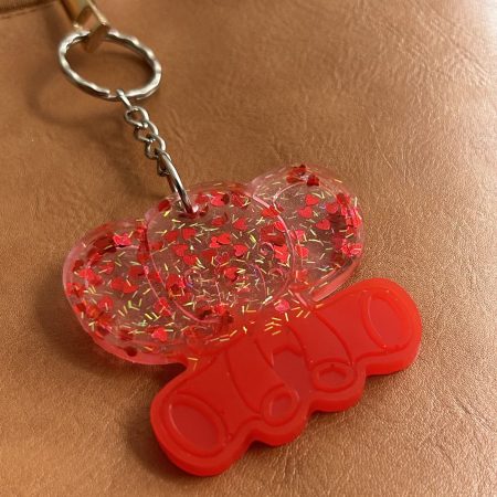 Resin elephant keychain with small heart sequins and fine sparkly glitter