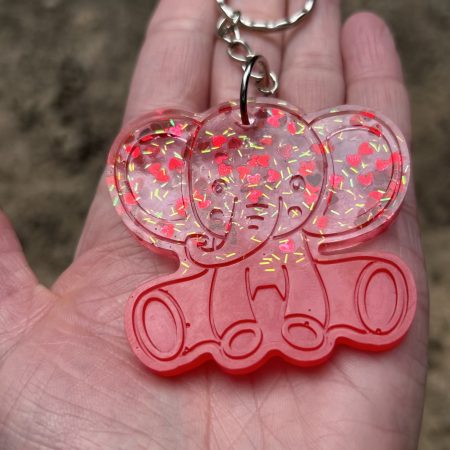 Resin elephant keychain with small heart sequins and fine sparkly glitter