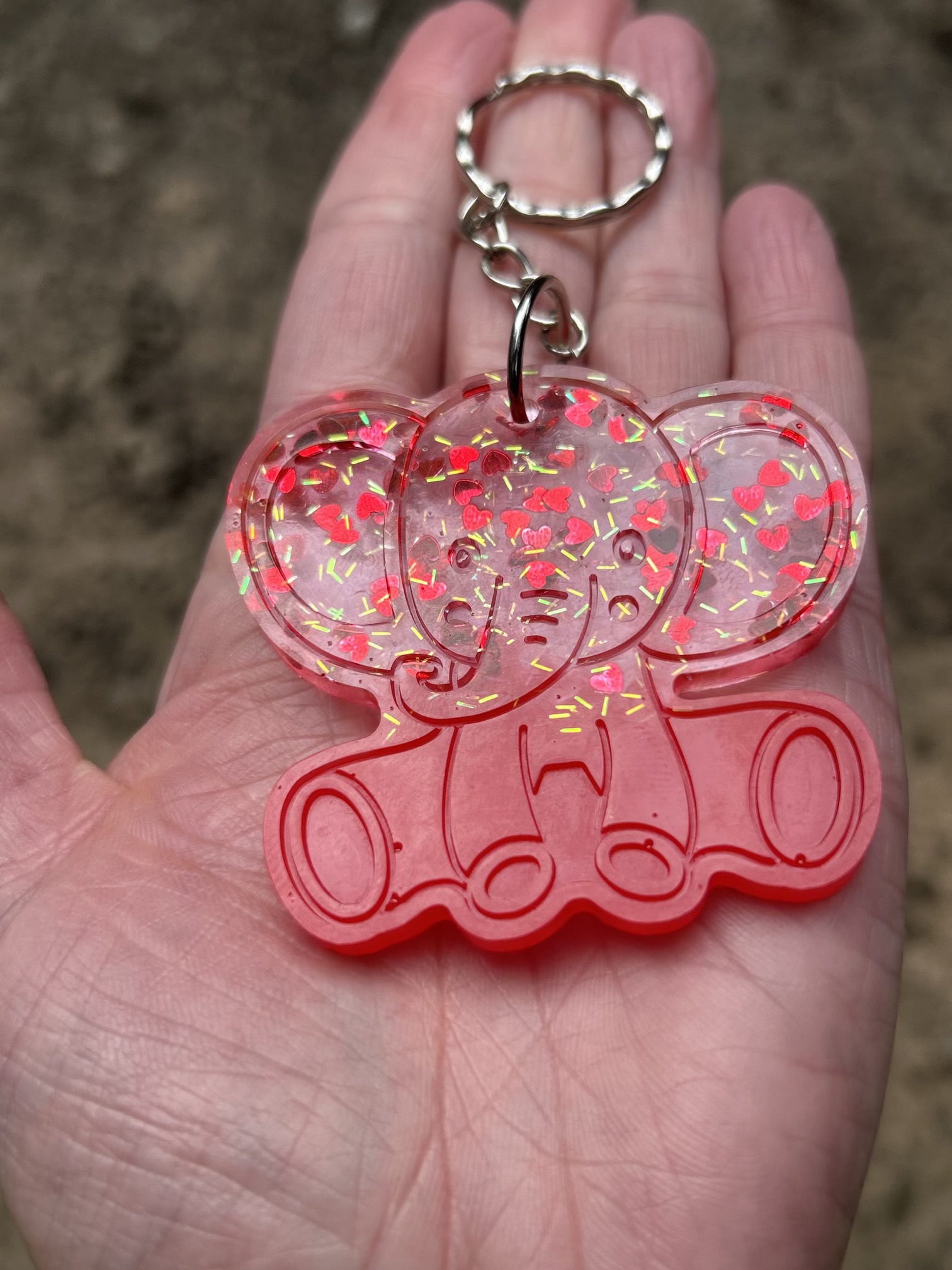 Resin elephant keychain with small heart sequins and fine sparkly glitter
