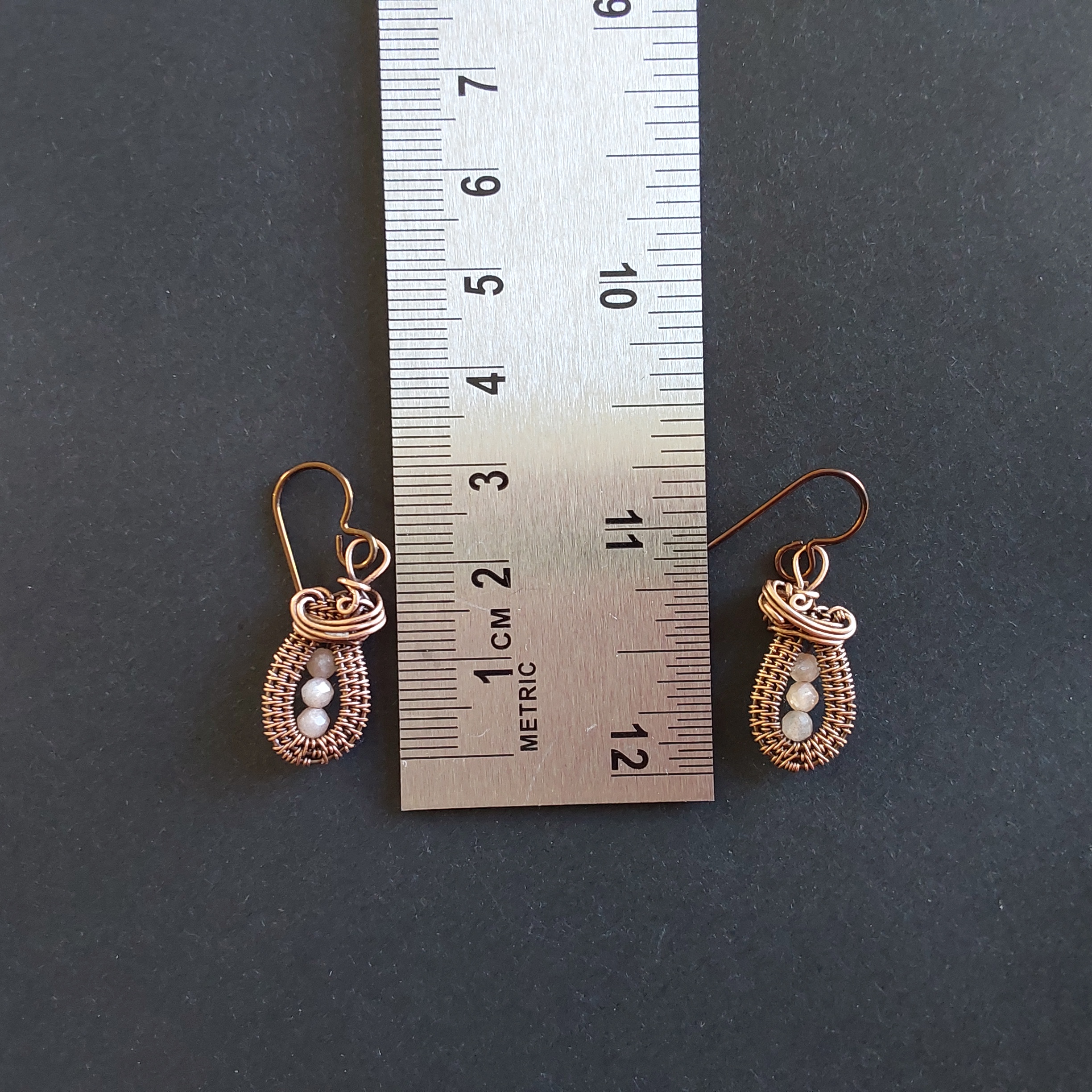 Faceted Peach Moonstone antiqued copper wire weave dangly earrings