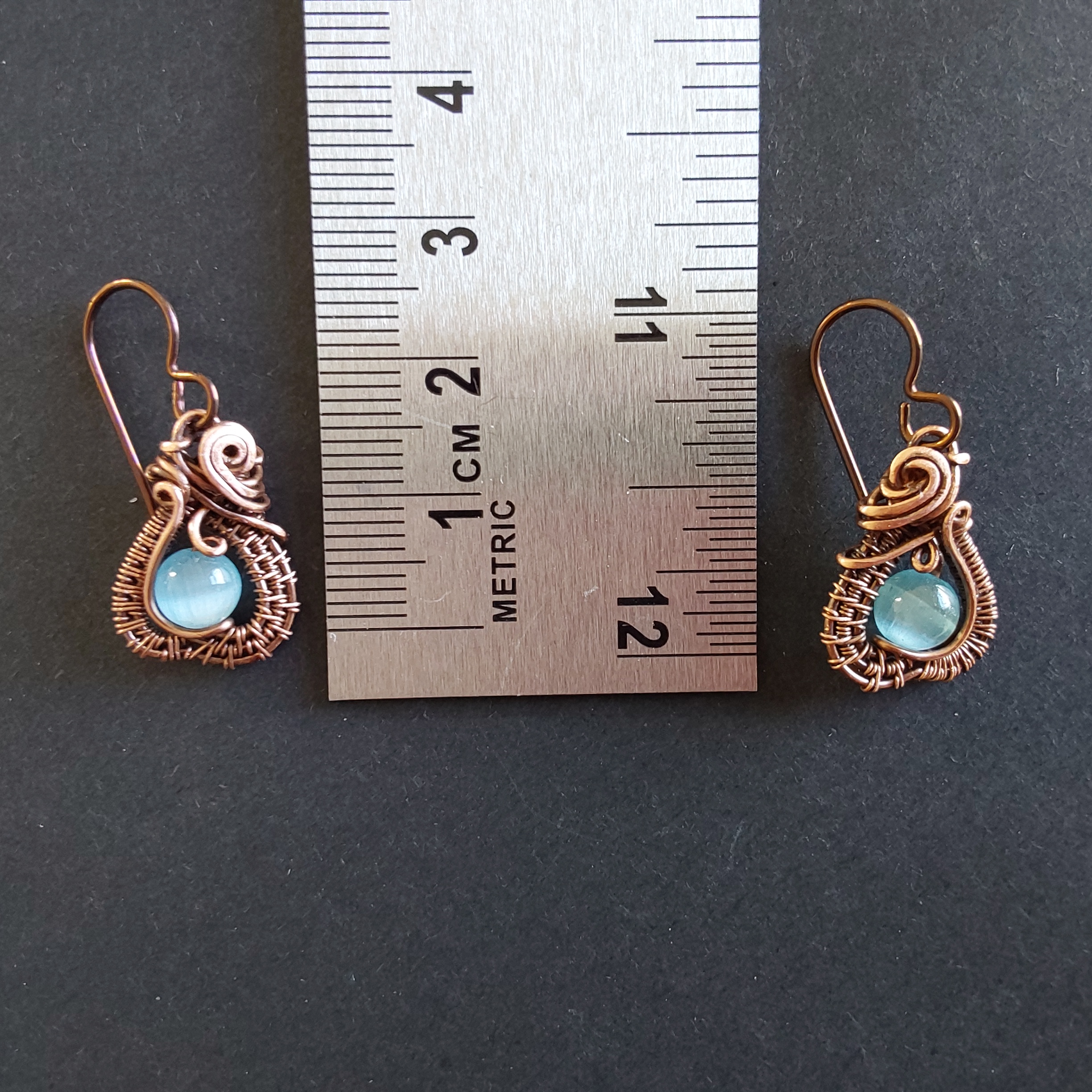Intricate wire weave earrings with Blue Cats Eye beads