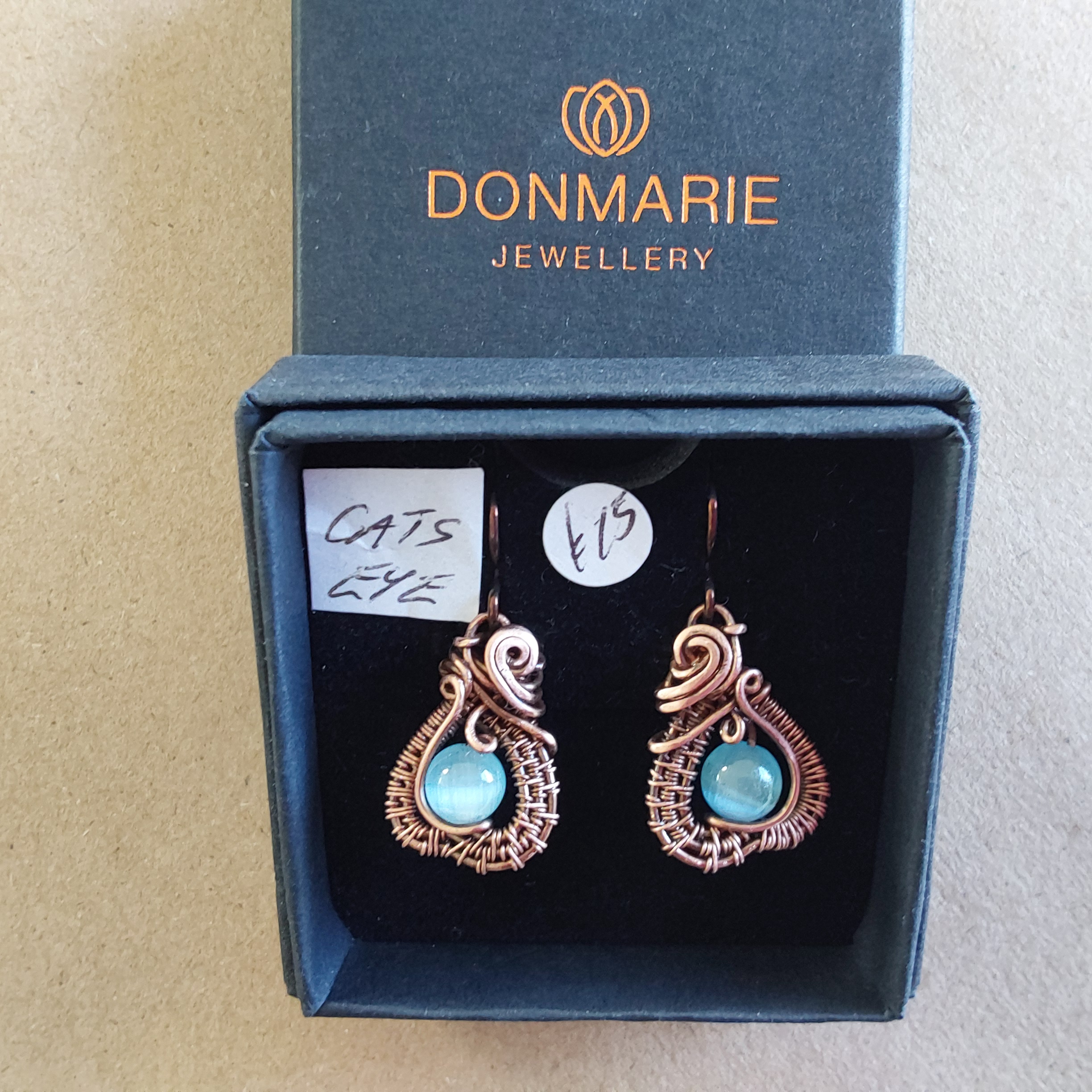 Intricate wire weave earrings with Blue Cats Eye beads