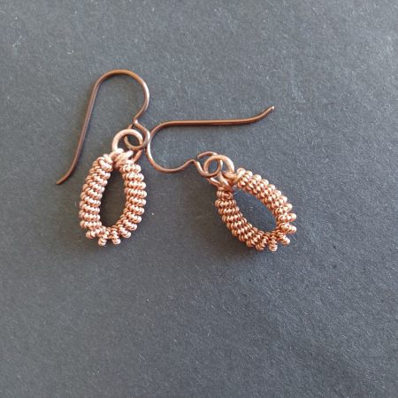 Handmade copper coiled coil dangly earrings with Niobium hypoallergenic ear wires.